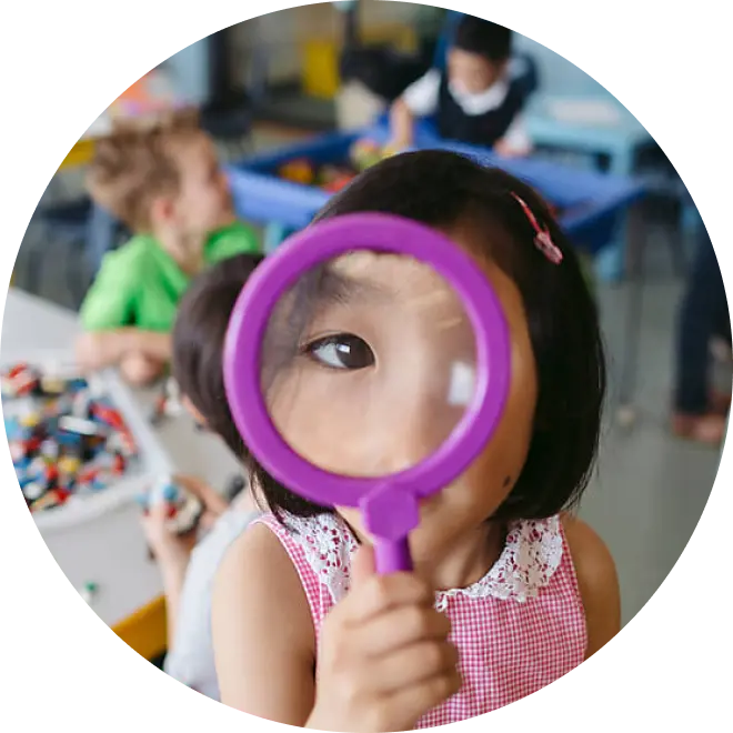 Girl with magnifying glass