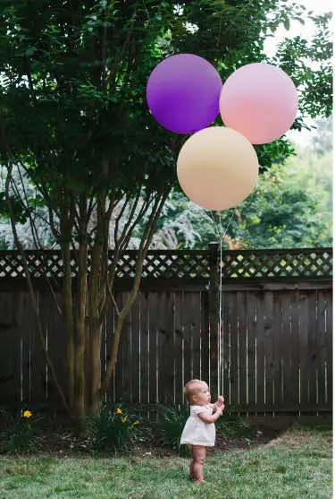 The baby with baloons