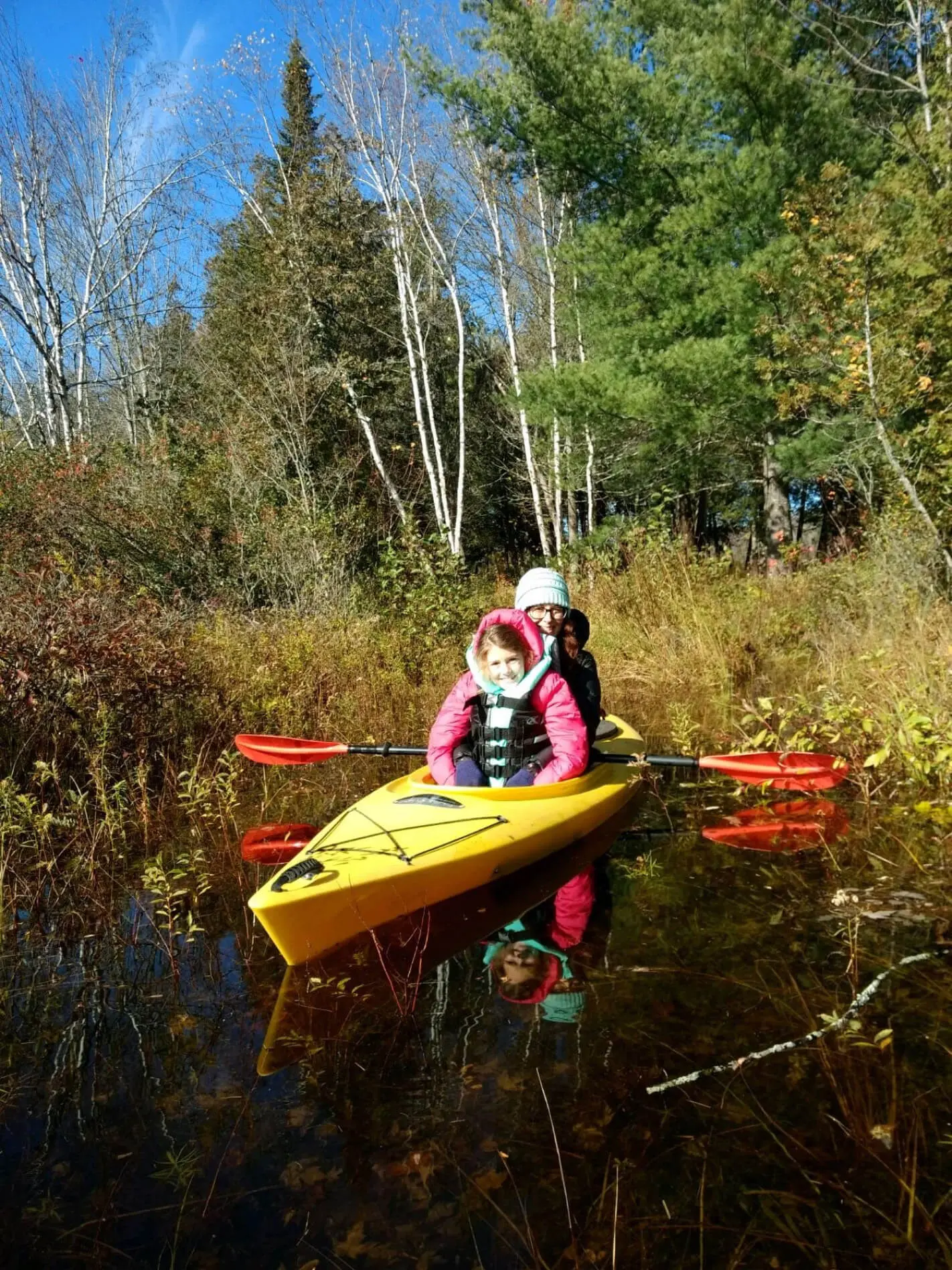 Fabric employee Glenda with her daughter in a kayak on a company-wide bonding day.
